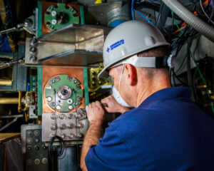 An engineer using a wrench.