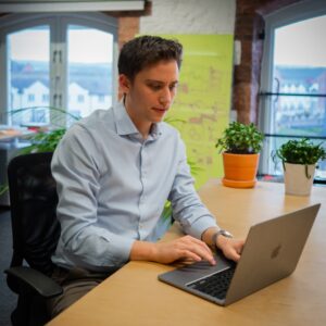 A scientist works on a laptop